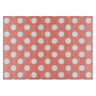 White polka dots on peach cutting board