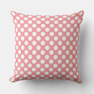 White polka dots on pink background cushion