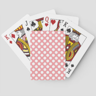 White polka dots on pink background playing cards