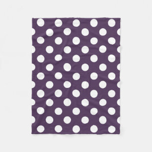White polka dots on plum purple fleece blanket