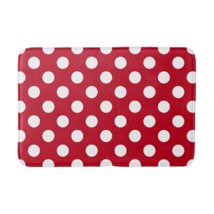 White polka dots on red bath mat