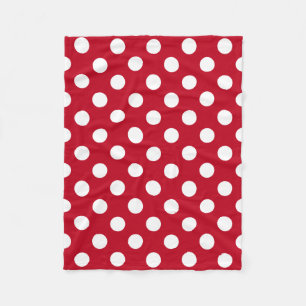 White polka dots on red fleece blanket