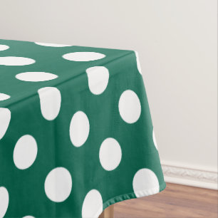 White polka dots on sage green tablecloth