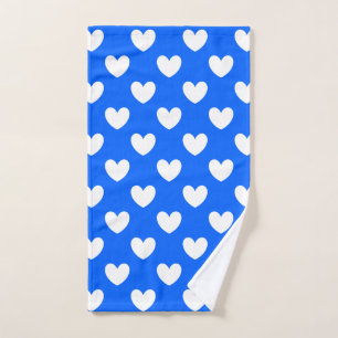 White polka hearts on blue hand towel