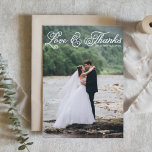White Pretty Script Photo Wedding Thank You Postcard<br><div class="desc">Send a personal and stylish message of gratitude with this custom photo wedding thank you card. Designed with a white “Love & Thanks” overlay in whimsical rustic script, this card features your favourite wedding photo as the full background. Easily personalise with your photo, names, wedding date, and thank you message....</div>