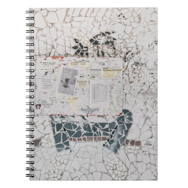 White printer paper on white and grey concrete wal notebook (Front)