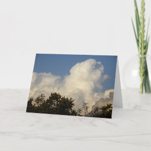 White Puffy Clouds over Treetops Background Card