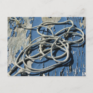 White rope on a blue boat with flaking paint postcard