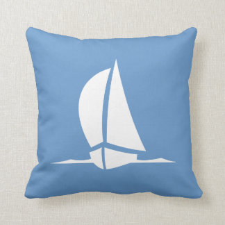 white sailboat on blue pillow