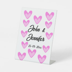 white simple minimal text style wedding pinkheart pedestal sign