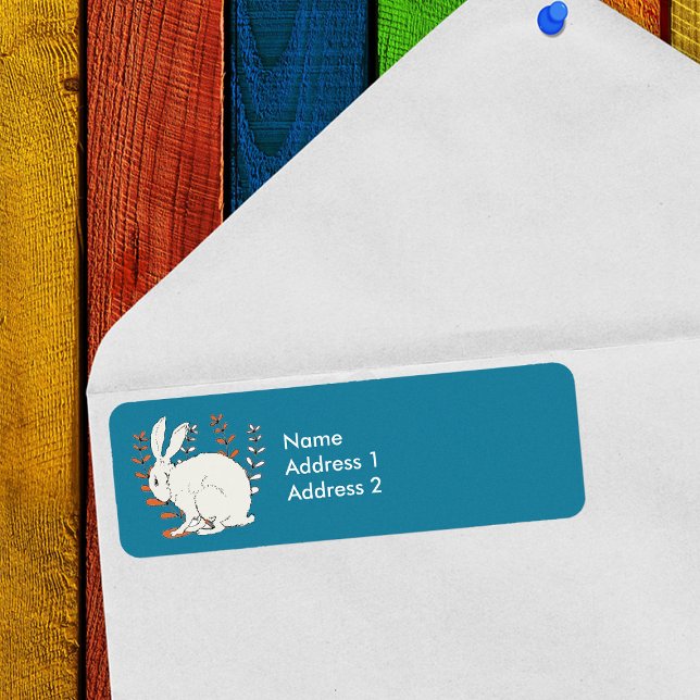 White sitting Rabbit Orange White Plants on blue (White Rabbit sitting in orange and white plants on dark blue return address labels.)