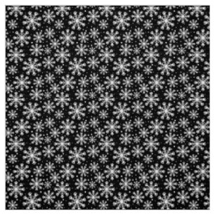 White Snowflake on black with paw print pattern Fabric