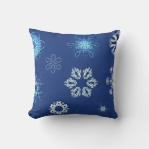 White snowflakes on blue cushion