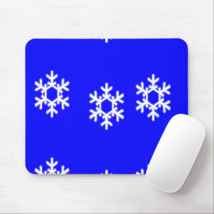 White snowflakes on blue mouse pad