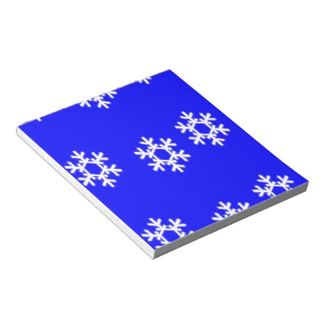 White snowflakes on blue notepad (Angled)