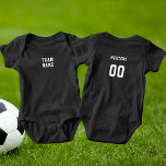 White Sports Team Name & Number Dark Baby Bodysuit<br><div class="desc">White Sports Team Name & Number Dark Baby Bodysuit. The shirt features a sports team theme with customised text on both sides with the team name,  your name,  and player number. You can personalise this template with your information.</div>