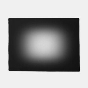 White spotlight on black doormat