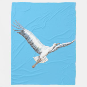 White stork flying on blue background fleece blanket