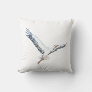 White stork flying throw pillow