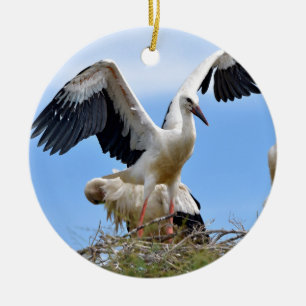 White storks on their nest ceramic tree decoration