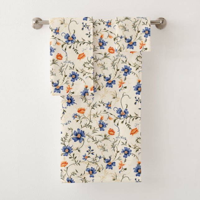 White towel with a floral pattern featuring blue  (Insitu)