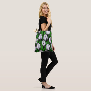White tulips with green leaves tote bag