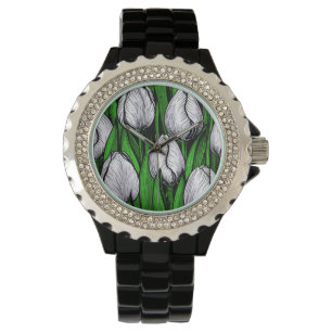 White tulips with green leaves watch