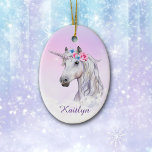White Unicorn Floral Believe Ceramic Tree Decoration<br><div class="desc">A beautiful white unicorn is decorated with pink and blue flowers, and rises out of fluffy white clouds on this pretty ornament for her. The unicorn image is placed on a gradient pink lavender background with scattered distant stars. At the bottom is her name in darker lavender. The back of...</div>