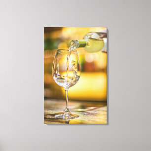 White wine is poured from bottle in restaurant. canvas print