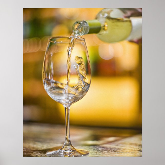 White wine is poured from bottle in restaurant. poster (Front)