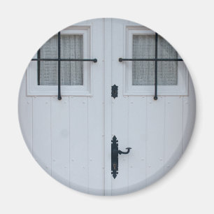 White Wooden Door With Black Wrought Iron Works Magnet