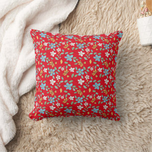 White yellow blue flowers on scarlet background. cushion