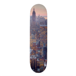 Wide view of Manhattan at sunset Skateboard