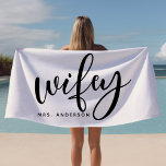 Wifey Black And White Newlywed Bride Beach Towel<br><div class="desc">Celebrate your new status with this stylish "Wifey" beach towel in classic black and white, perfect for honeymoons, beach outings, or poolside relaxation. Designed with newlyweds in mind, this towel can be personalised with a last name, making it an ideal gift or accessory for brides. Whether for a beach honeymoon...</div>