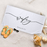 Wifey Minimalist Calligraphy Beach Towel<br><div class="desc">Soak up the sun in style with our Wifey Minimalist Calligraphy Beach Towel. This chic, soft, and absorbent towel features elegant calligraphy that celebrates your newlywed status with a touch of modern simplicity. Whether you're lounging by the pool or enjoying a beach getaway, this towel is the perfect accessory to...</div>