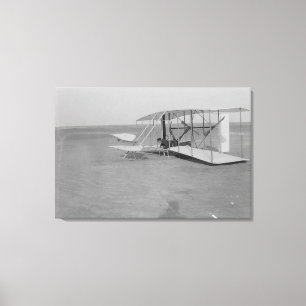 Wilbur Wright in damaged plane after Canvas Print