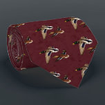 Wild Ducks in Flight Maroon Tie<br><div class="desc">Male and female mallard ducks flying over a golden pond,  water rippling to reflect the colors of the background autumn foliage glowing in the sunlight,  all on a sophisticated maroon patterned background.</div>