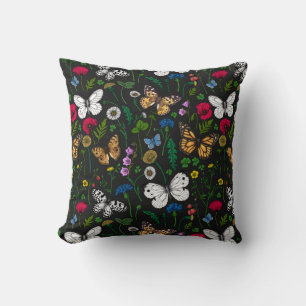 Wild flowers and butterflies on black cushion