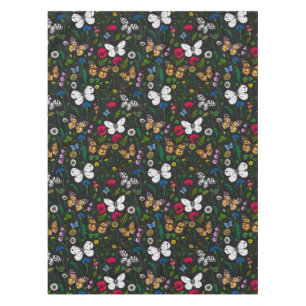 Wild flowers and butterflies on black tablecloth
