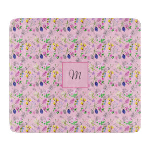Wild flowers in watercolour, on pink. Monogram Cutting Board