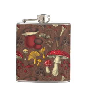 Wild mushrooms on brown hip flask