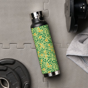 Wild roses in yellow and green water bottle
