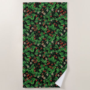 Wild strawberries on black beach towel