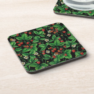 Wild strawberries on black coaster
