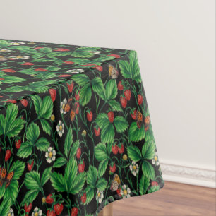 Wild strawberries on black tablecloth