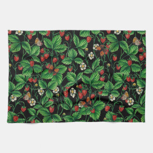 Wild strawberries on black tea towel