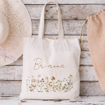 Wildflower Boho Bridesmaid Name Tote Bag<br><div class="desc">Elevate your bridesmaid proposal or thank-you gesture with our charming Wildflower Boho Bridesmaid Name Tote Bag! Crafted with love and adorned with intricate floral designs, this tote bag perfectly captures the essence of bohemian elegance. Each bag is personalised with your bridesmaid's name, adding a thoughtful touch that celebrates her unique...</div>