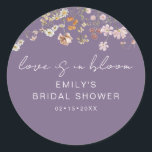 Wildflower Purple Bridal Shower Love is In Bloom Classic Round Sticker<br><div class="desc">Express gratitude with our Wildflower Thank You Bridal Shower In Bloom Classic Round Sticker. These charming stickers feature a delightful wildflower design, infusing a touch of natural beauty into your bridal shower thank-you notes or favours. The classic round shape adds versatility, making them perfect for various uses, from sealing envelopes...</div>