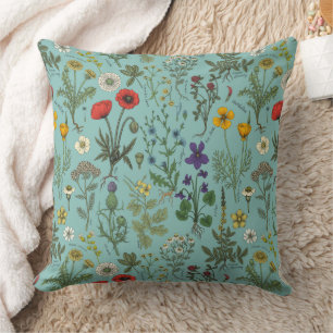 Wildflowers collage on blue cushion