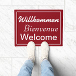 Willkommen Bienvenue Welcome Multilingual Doormat<br><div class="desc">Welcome your guests with a multilingual doormat featuring the German,  French and English words "Welcome". Shown here in dark red,  you can edit the background colour to the colour of your choice by selecting the "customise it" button.</div>